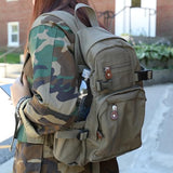 Rothco Vintage Canvas Compact Backpack, Small Cotton Canvas Daypack with Multi Pockets, Adjustable Straps, Mini Travel Bag (Woodland Camo)