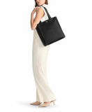 TUMI - Voyageur Vail Leather Tote - Women's Lightweight, Multipurpose, Everyday Bag with Crossbody Strap and Laptop Storage - North/South, Black with Light Gold Hardware