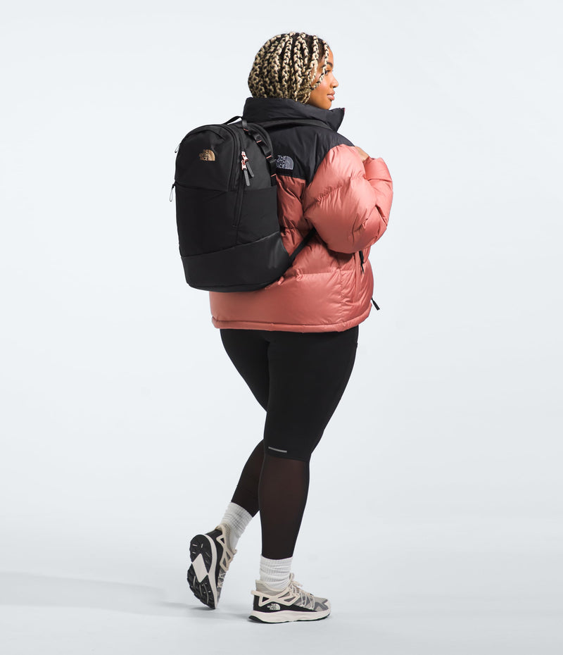 The North Face Women's Isabella Transit Backpack | Commuter Travel Bag with 16" Laptop Sleeve, Water-Repellent Finish, Women-Specific Fit, TNF Black Light Heather/Burnt Coral Metallic-NPF, One Size