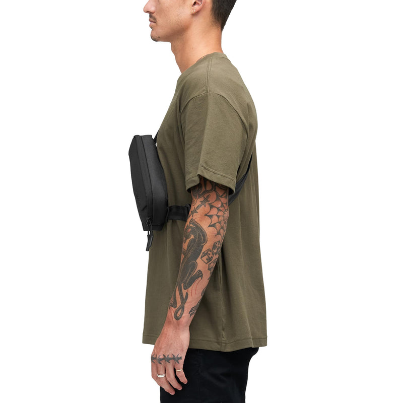 Incase Crosstown Sling. Compact, Durable Sling Bag with Weather-Resistant Woolenex, Crossbody or Hip Carry, Faux Fur-Lined Device Pocket, Easy Access Front Pocket - Black