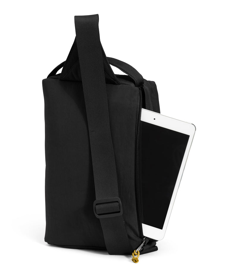The North Face Berkeley Field Bag | Water Repellent Finish, Vintage Style Travel Essential, Sling Holds Water Bottles, Phones & Keys, TNF Black/Mineral Gold-NPF, One Size