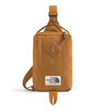 The North Face Berkeley Field Bag | Water Repellent Finish, Vintage Style Travel Essential, Sling Holds Water Bottles, Phones & Keys, Timber Tan/TNF Black, One Size