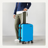 Amazon Basics 21" Hardside Carry - On Luggage with Expandable Space, Scratch - Resistant Surface, Telescoping Handle, Four Multi - directional Wheels, Light Blue
