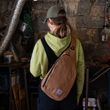 Carhartt Durable Sling Bag, Crossbody Backpack with Side Release Buckle, Tablet Sleeve and Adjustable Strap, Gravel