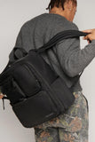 Itzy Ritzy Utility Diaper Bag Backpack – Features 17 Pockets (Including 2 Insulated Bottle Holders) & Trolley Sleeve and Includes Stroller Straps & Changing Pad – Part of the Belong Collection (Black)
