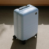 Monos Carry-On Luggage 22 Inch – Lightweight Hardside Spinner Suitcase with TSA Lock | Airline Approved, 39.9L Polycarbonate Rolling Carry On Bag | Overhead Bin Suitcase for Travel | Blue Haze