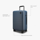 Monos Carry - On Plus Luggage (23"), Lightweight Hardside Spinner Suitcase with TSA Lock, Airline Approved, Ocean Blue