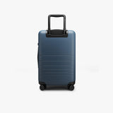 Monos Carry - On Plus Luggage (23"), Lightweight Hardside Spinner Suitcase with TSA Lock, Airline Approved, Ocean Blue