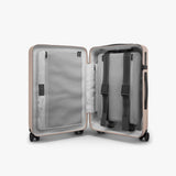 Monos Carry - On Pro Luggage (22"), Hardside Spinner Suitcase with TSA Lock & Front Pocket, Airline Approved, Rose Quartz, Pink