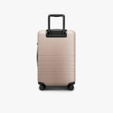 Monos Carry - On Pro Luggage (22"), Hardside Spinner Suitcase with TSA Lock & Front Pocket, Airline Approved, Rose Quartz, Pink