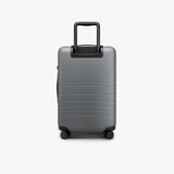 Monos Carry - On Pro Luggage (22"), Hardside Spinner Suitcase with TSA Lock & Front Pocket, Airline Approved, Storm Grey