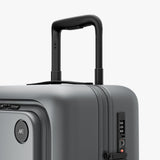 Monos Carry - On Pro Luggage (22"), Hardside Spinner Suitcase with TSA Lock & Front Pocket, Airline Approved, Storm Grey