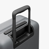 Monos Carry - On Pro Luggage (22"), Hardside Spinner Suitcase with TSA Lock & Front Pocket, Airline Approved, Storm Grey
