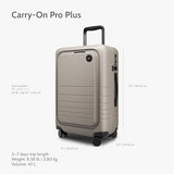 Monos Carry - On Pro Plus Luggage (23"), Hardside Spinner Suitcase with TSA Lock & Front Pocket, Airline Approved, Desert Taupe, Beige