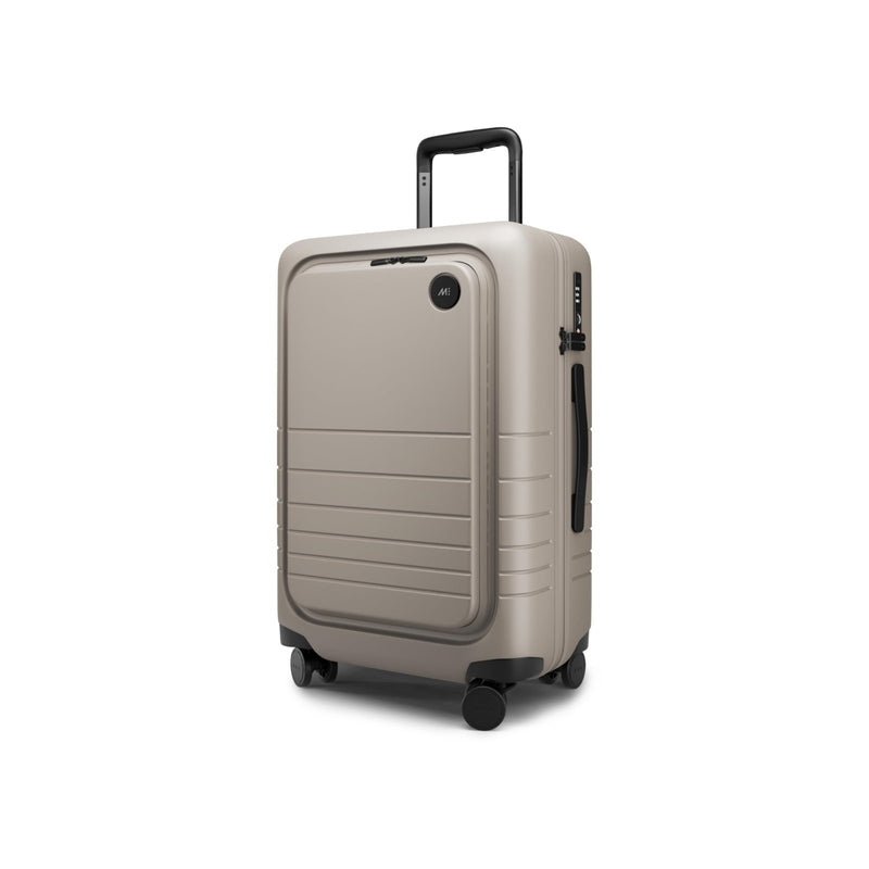 Monos Carry - On Pro Plus Luggage (23"), Hardside Spinner Suitcase with TSA Lock & Front Pocket, Airline Approved, Desert Taupe, Beige