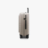Monos Carry - On Pro Plus Luggage (23"), Hardside Spinner Suitcase with TSA Lock & Front Pocket, Airline Approved, Desert Taupe, Beige
