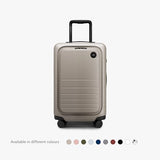 Monos Carry - On Pro Plus Luggage (23"), Hardside Spinner Suitcase with TSA Lock & Front Pocket, Airline Approved, Desert Taupe, Beige