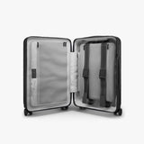 Monos Carry - On Pro Plus Luggage (23"), Hardside Spinner Suitcase with TSA Lock & Front Pocket, Airline Approved, Midnight Black