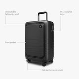 Monos Carry - On Pro Plus Luggage (23"), Hardside Spinner Suitcase with TSA Lock & Front Pocket, Airline Approved, Midnight Black