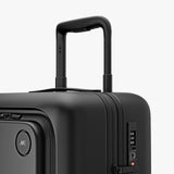 Monos Carry - On Pro Plus Luggage (23"), Hardside Spinner Suitcase with TSA Lock & Front Pocket, Airline Approved, Midnight Black