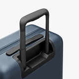 Monos Carry - On Pro Plus Luggage (23"), Hardside Spinner Suitcase with TSA Lock & Front Pocket, Airline Approved, Ocean Blue