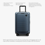 Monos Carry - On Pro Plus Luggage (23"), Hardside Spinner Suitcase with TSA Lock & Front Pocket, Airline Approved, Ocean Blue