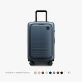 Monos Carry - On Pro Plus Luggage (23"), Hardside Spinner Suitcase with TSA Lock & Front Pocket, Airline Approved, Ocean Blue