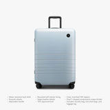 Monos Medium Checked Luggage (26.5"), Lightweight Hardside Spinner Suitcase with TSA Lock, Durable Travel Case, Blue Haze