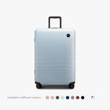 Monos Medium Checked Luggage (26.5"), Lightweight Hardside Spinner Suitcase with TSA Lock, Durable Travel Case, Blue Haze