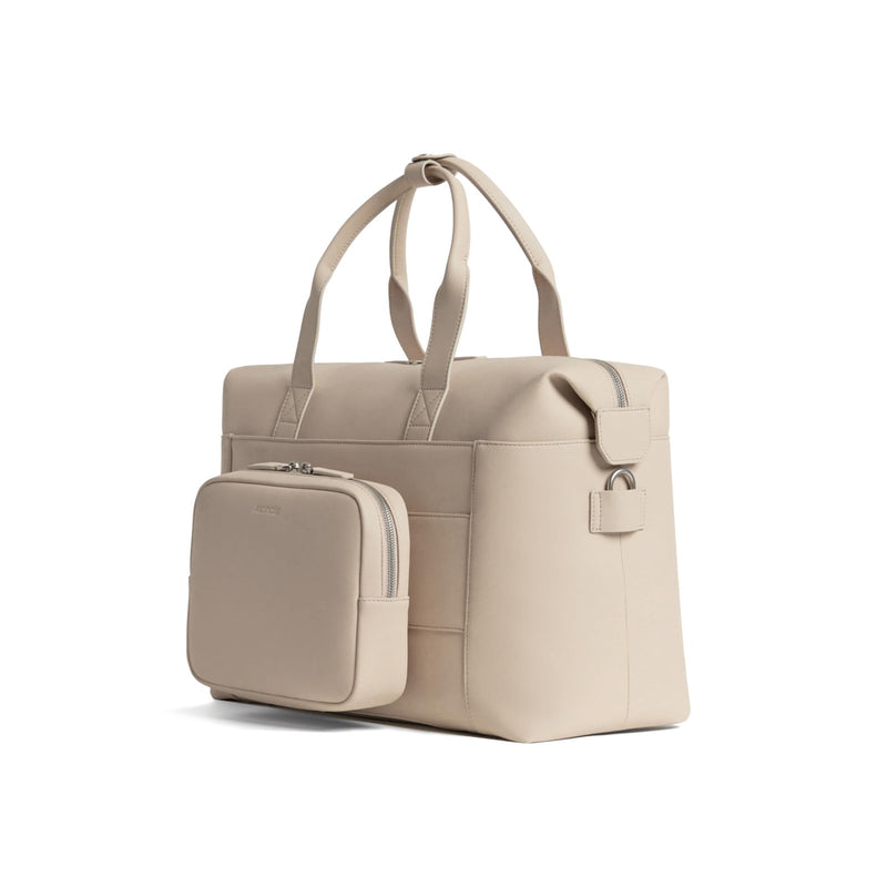 Monos Metro Duffel Vegan Leather Microfiber, Travel Duffel Bag & Weekender with Shoe Compartment, Carry - On Approved, Ivory