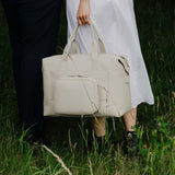 Monos Metro Duffel Vegan Leather Microfiber, Travel Duffel Bag & Weekender with Shoe Compartment, Carry - On Approved, Ivory