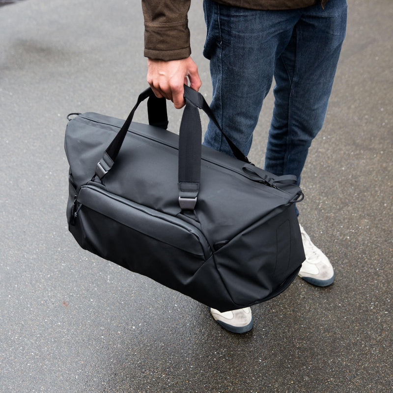Peak Design Travel Duffel 50L, Black, Extra - Wide Single Zip Access, Weatherproof Shell, 4 External Pockets, Fits Packing Cubes & Camera Cubes, Ideal for Weekend Trips, Versatile Duffel Bag for Travel