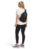 The North Face Women's Isabella Sling - Slim Carry Crossbody Bag with Large Main Compartment, Water - Repellent Finish, TNF Black Light Heather/Burnt Coral Metallic - NPF, One Size